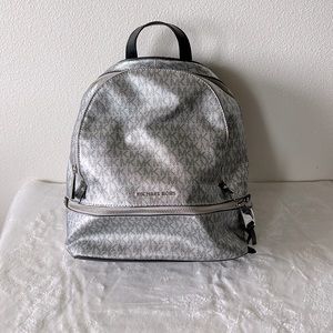 Michael Kors Backpack purse with matching wallet.